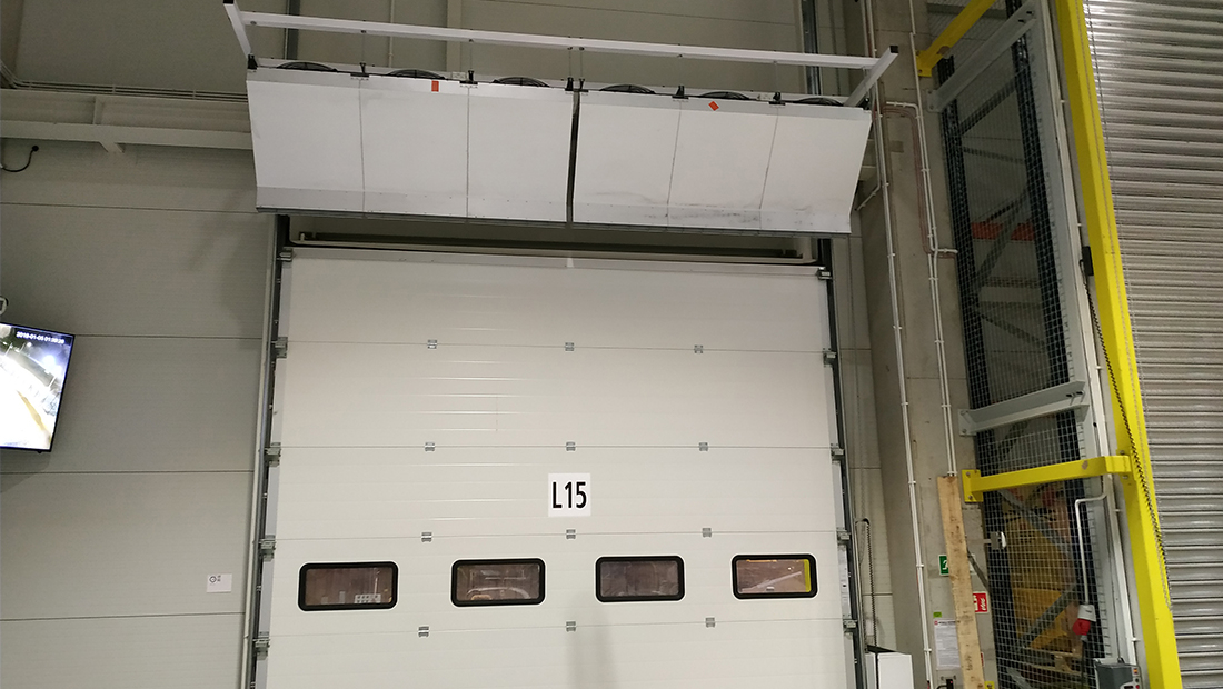 An air curtain creates a separation between the cold(er) outside air and the warm(er) indoor air temperature.